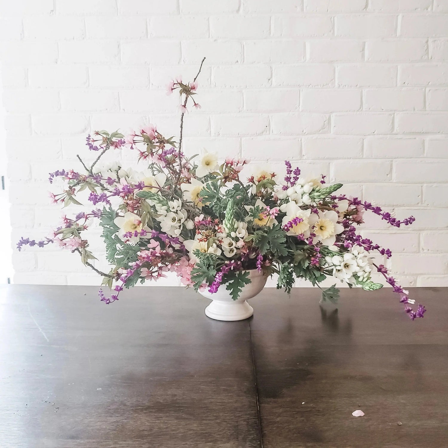 floral delivery arrangement made of seasonal flowering branches