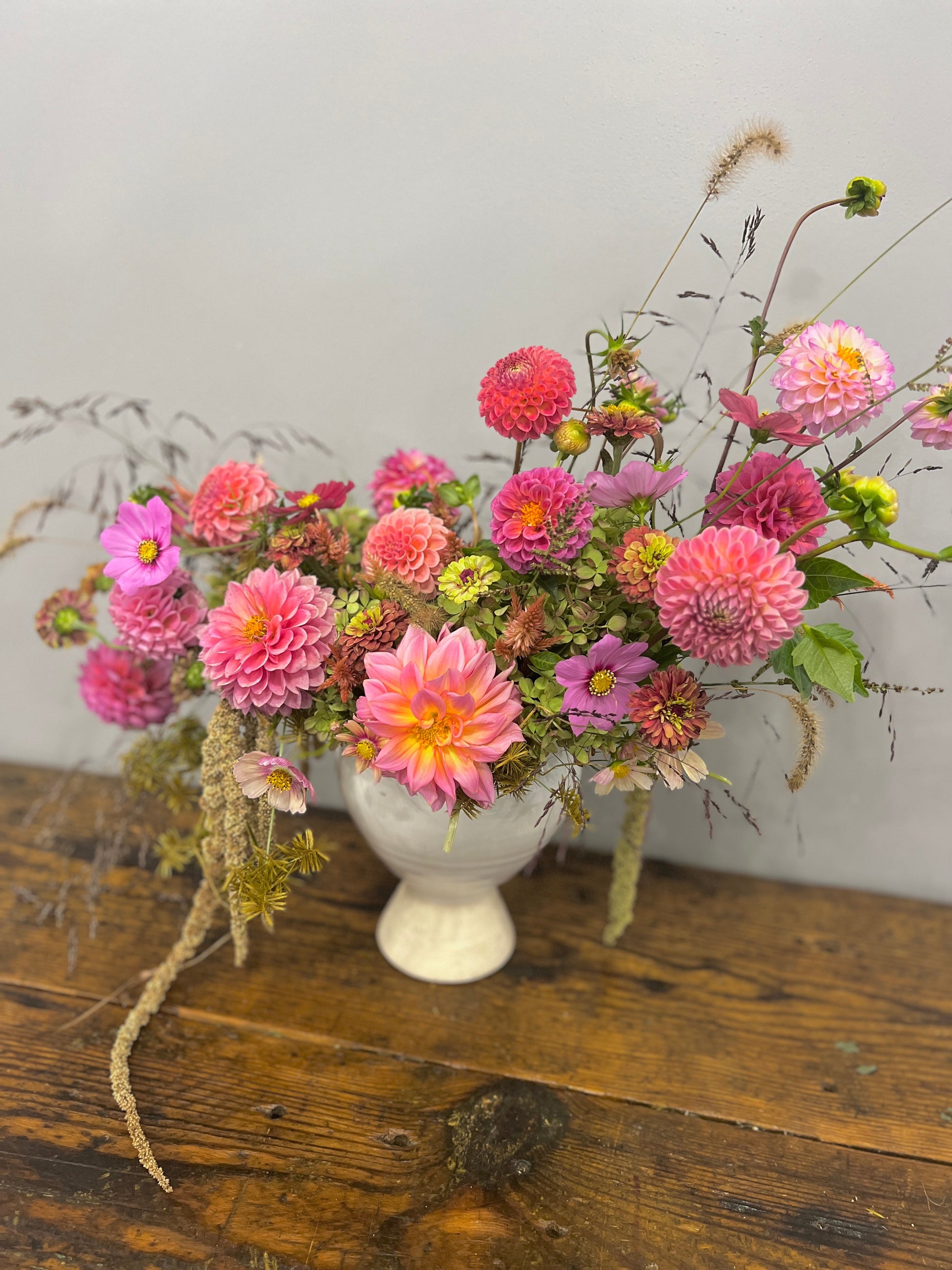 melon wedding arrangement with dahlias, zinnias, cosmos, and local grasses Sweet Blossoms LLC
